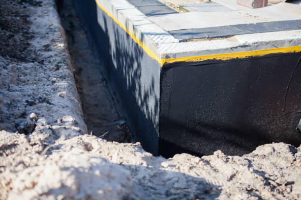Professional Emergency Waterproofing technician working in Harrisburg, NC